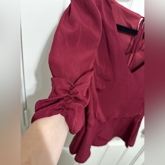Francesca's Collections Burgundy Puff Sleeve Peplum Blouse - Picture 3 of 4